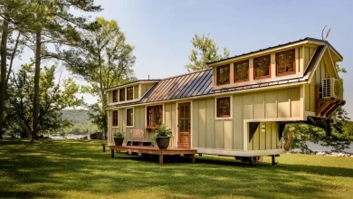 Charming Timbercraft tiny house is surprisingly spacious.